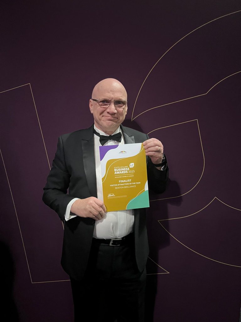 Ross Ashton holding the certificate of nomination for finalist in the South Holland Business Awards 2025